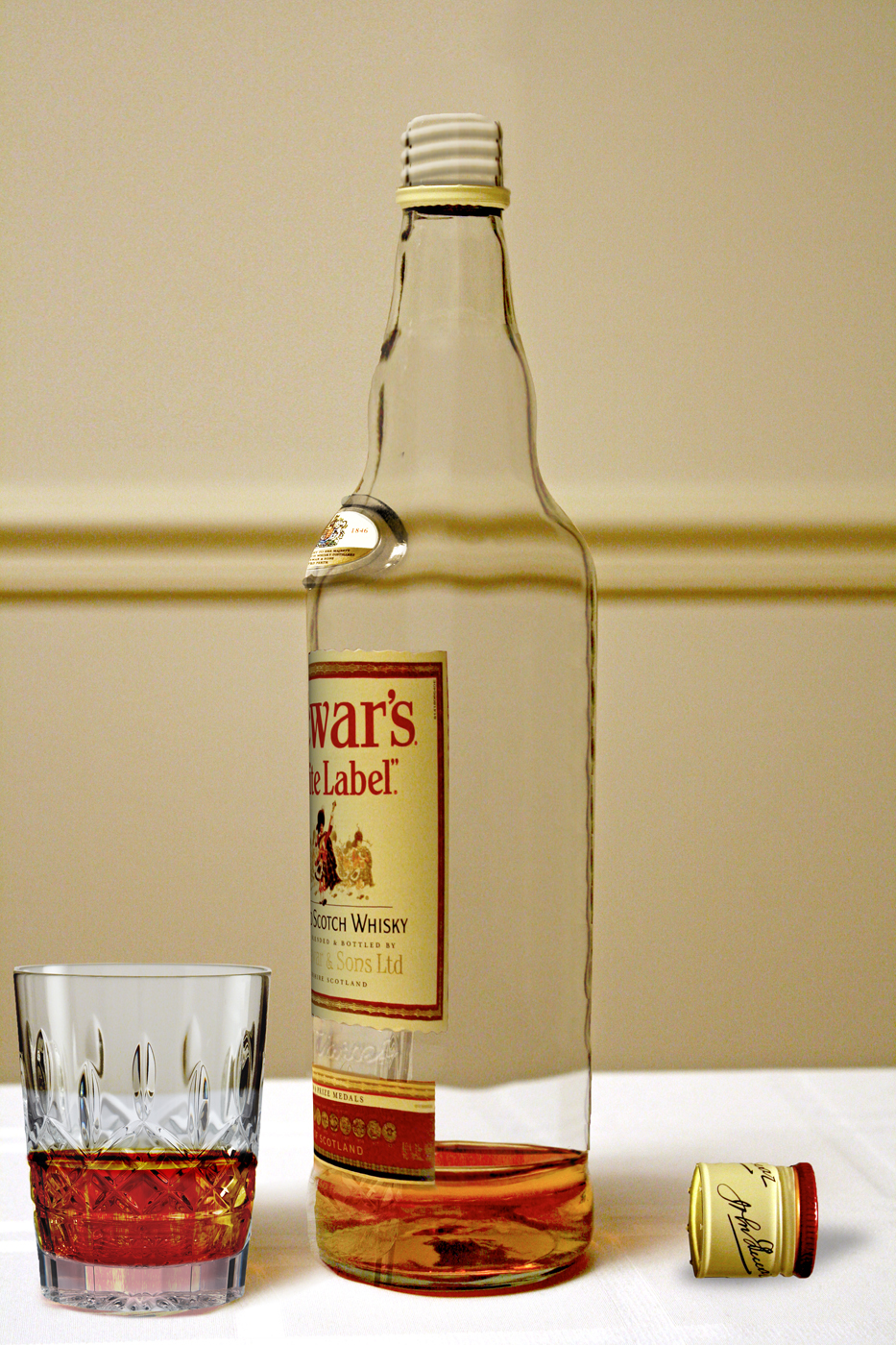 Almost empty whisky bottle